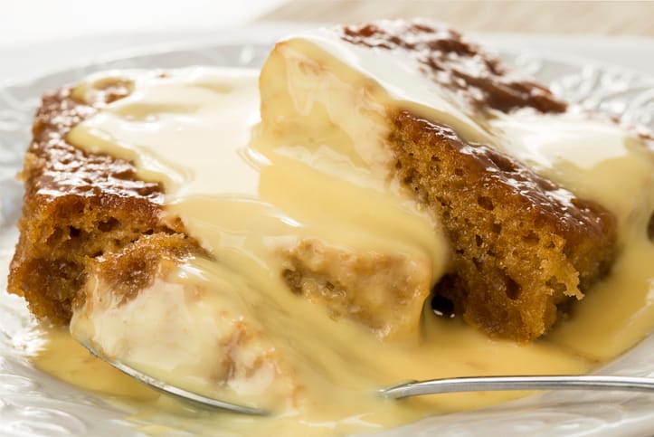 Malva pudding with custard, a traditional treat from South African cuisine