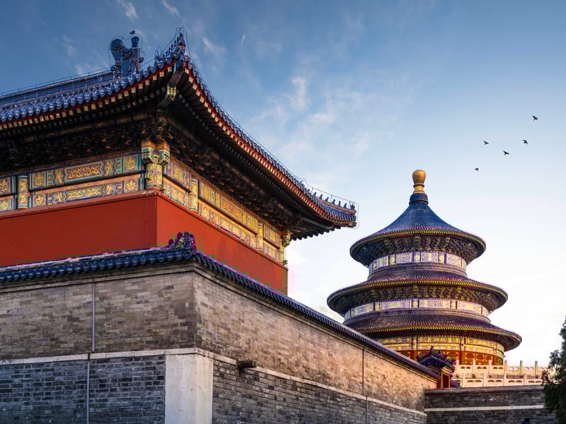 The Temple of Heaven in Beijing, China, featuring ancient buildings with distinctive Ming and Qing Dynasty design