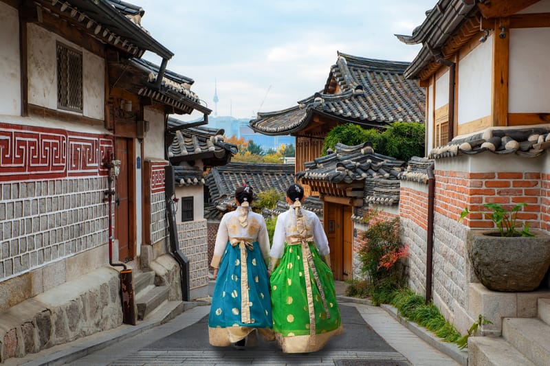 Women Wearing Hanbok Stroll Through the Traditional Tea Houses of Bukchon in Seoul