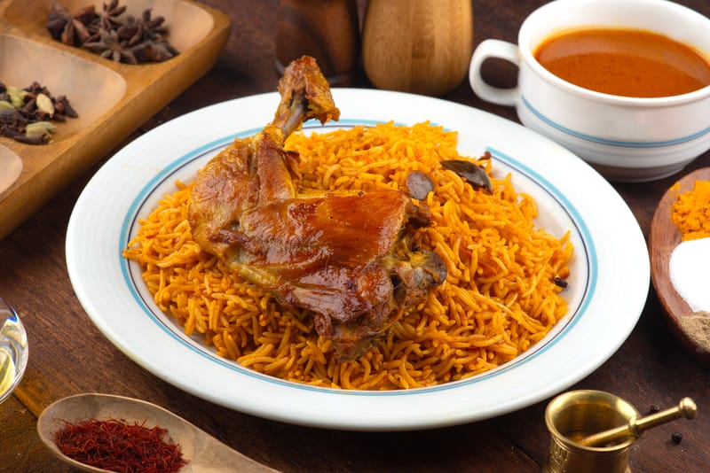 Mandi, with its smoky, slow-cooked meat and fragrant rice, is a centrepiece at Saudi gatherings.