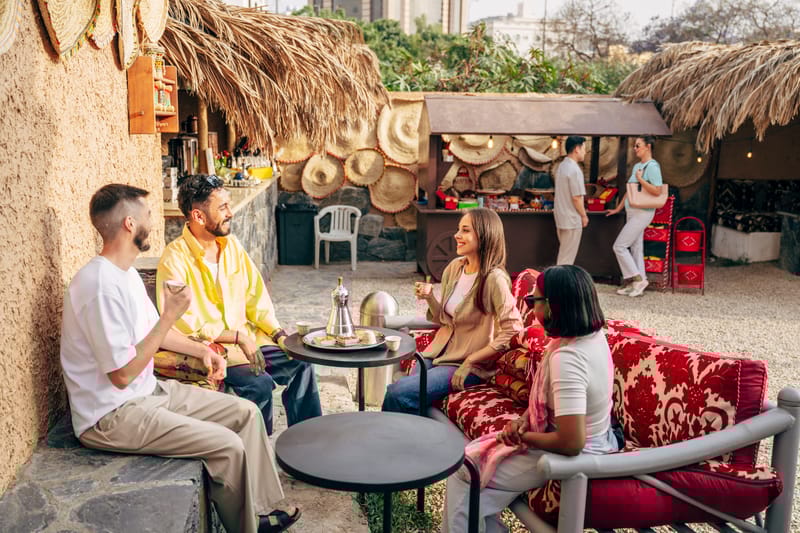 Friends gather over tea in a traditional cafe, soaking in the culture of Saudi Arabia