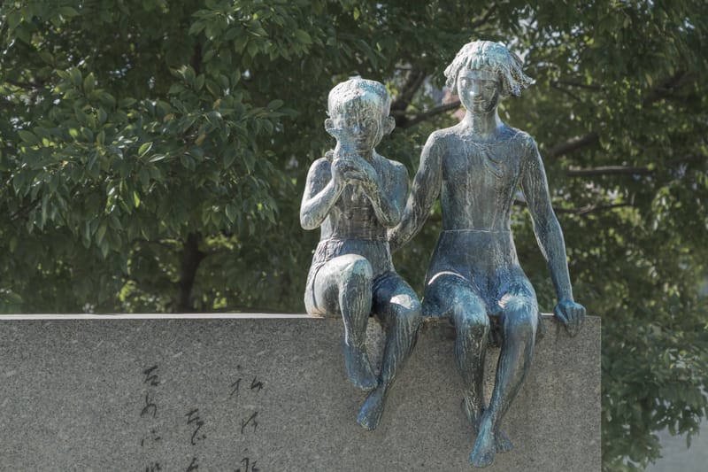 Statue of a boy and girl at the Children&rsquo;s Peace Monument in Hiroshima Peace Memorial Park