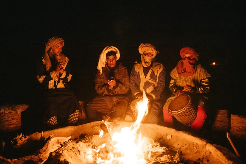 Berber hosts drum and sing around the fire long after dinner ends.