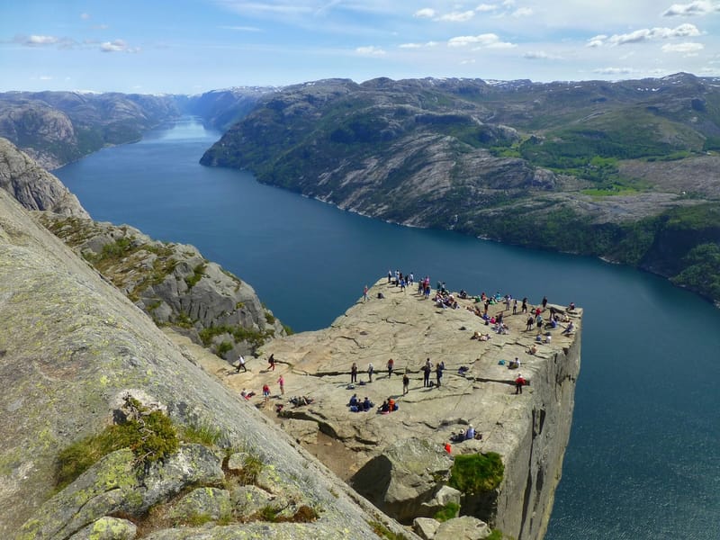 Hikers take in the vertiginous view from Pulpit Rock (Preikestolen), 604 metres above the Lysefjord in western Norway.