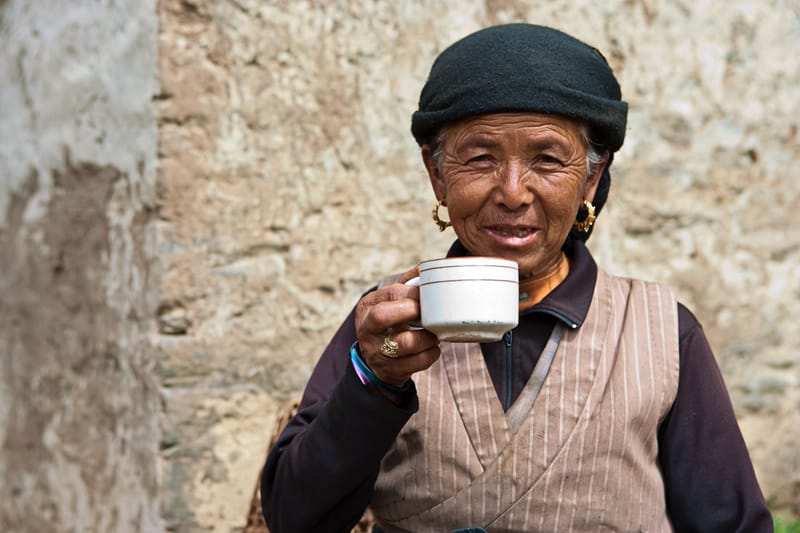 A Nepali woman drinking tea