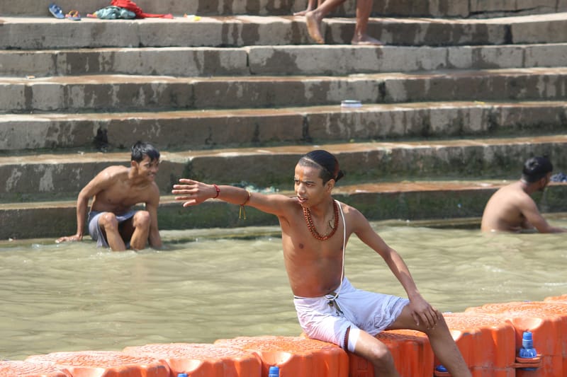 A local man washes bathes in the Ganges River.