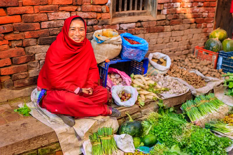 The streets of Kathmandu are a colourful sight with street sellers selling vegetables, fruit, snacks and more.