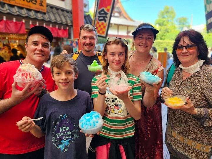 Inspiring Vacations customers visiting Japan and enjoying iced desserts on an Asia family tour