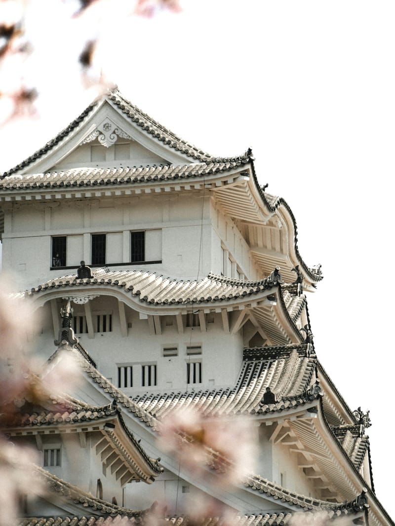 The white plaster facade of Himeji Castle.