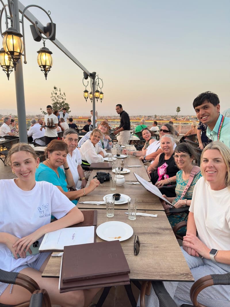 Inspiring Spain, Portugal, Morocco Travellers Enjoying a Group Dinner in Marrakech