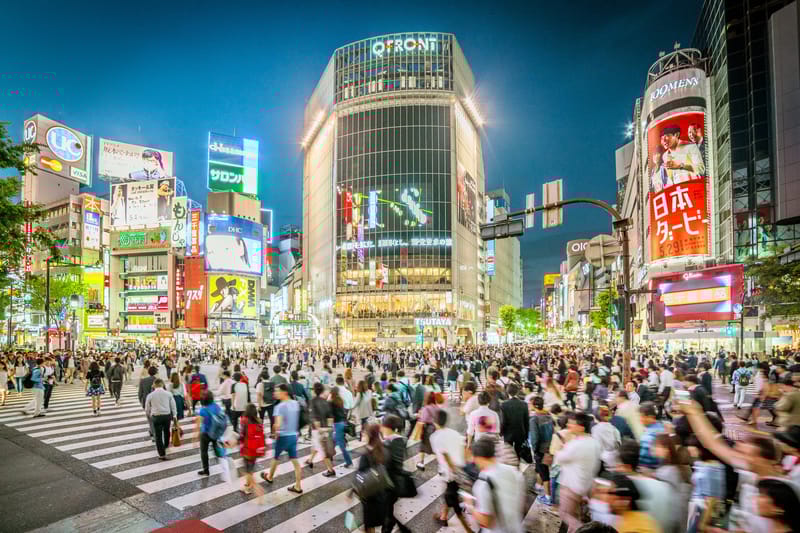 Crowds Move Through the Iconic Shibuya Crossing in Central Tokyo