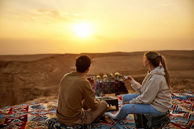 Tea at sunset in the Saudi desert, the kind of moment a guided tour builds into the day.